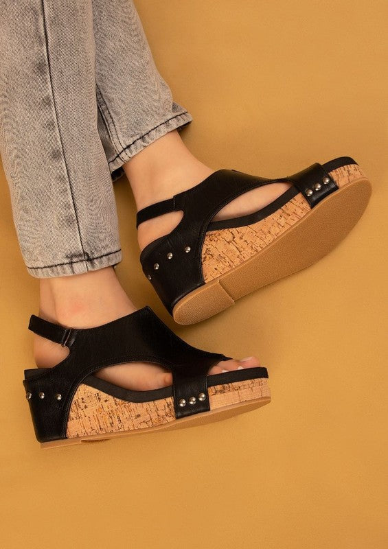 Platform wedge sandals with textured fabric upper, cutout design, ankle strap buckle, cork wedge heel, and open-toe style