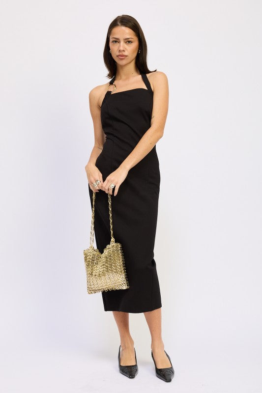 Woman models a chic halter neck midi dress in a black color, featuring an elegant design.