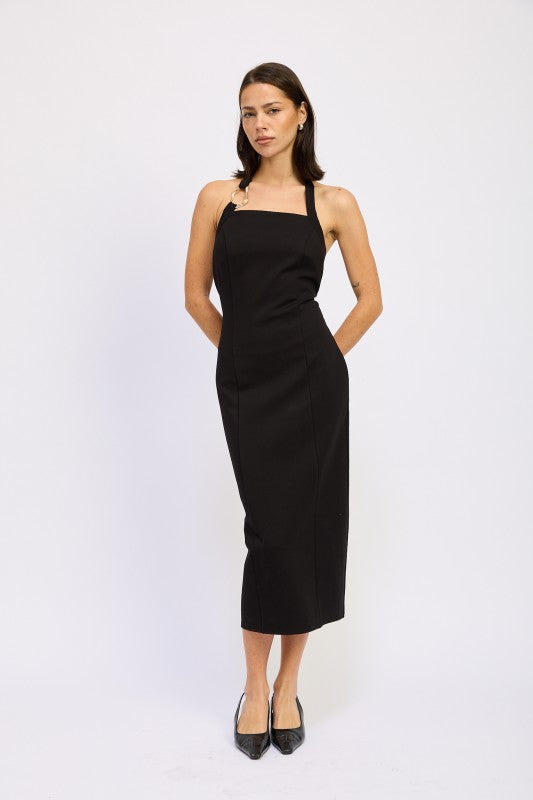 A woman wearing a chic halter neck midi dress in a black color, featuring an elegant design.