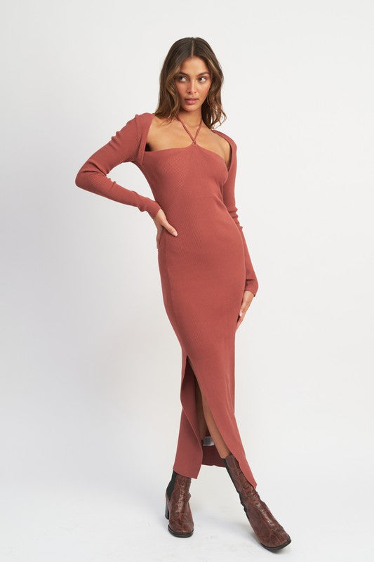 Woman wearing a rust-colored dress with a slit on a white background