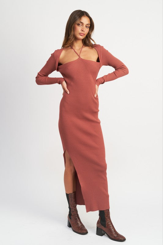 Woman wearing a rust-colored dress with a matching bolero on a white background