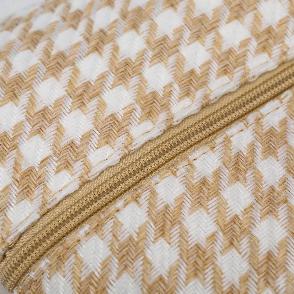 Beige and white houndstooth handbag with light gray handles and a structured, rounded shape. Soft and stylish—perfect for everyday fashion.