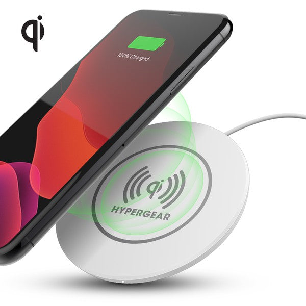 A HYPERGEAR Qi wireless charging pad powering a smartphone to 100%, with a connected cable and glowing charge indicator.