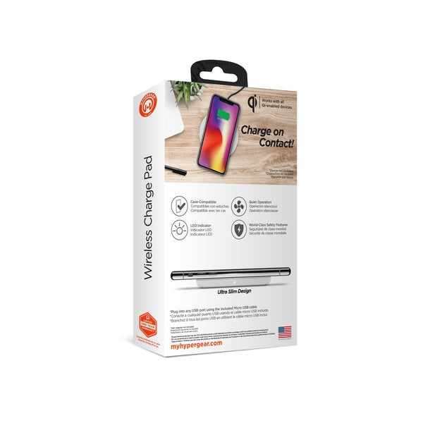 A HYPERGEAR Qi wireless charging pad powering a smartphone to 100%, with a connected cable and glowing charge indicator.
