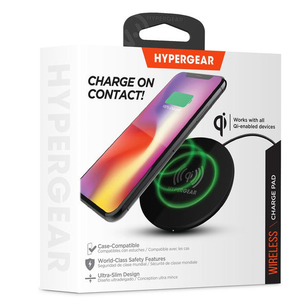 A HYPERGEAR Qi wireless charging pad powering a smartphone to 100%, with a connected cable and glowing charge indicator.