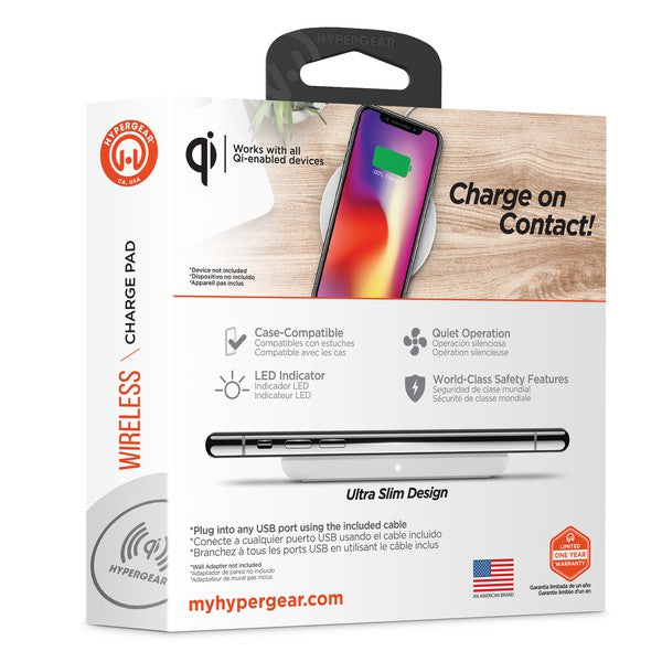 A HYPERGEAR Qi wireless charging pad powering a smartphone to 100%, with a connected cable and glowing charge indicator.
