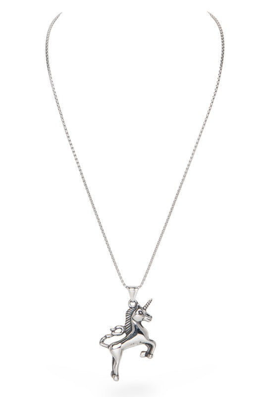 This image shows a silver unicorn pendant on a chain. The unicorn is posed on its hind legs with one front leg raised. It has a spiralled horn and a cut mane. The background is plain white.