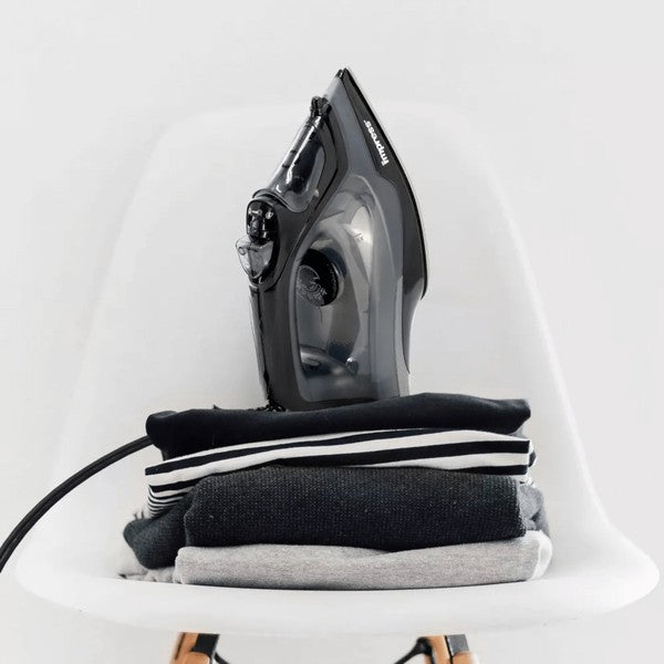 The Impress mid-size non-stick iron with spray burst is a versatile iron that smoothly glides over fabrics, features a non-stick soleplate, and includes a spray burst function for easy wrinkle removal.