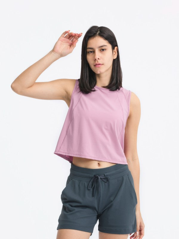 Flattering fit. Effortless style. The JupiterGear Round-Neck Cropped Tank is your new go-to for workouts, layering, and laid-back days. With a clean round neckline and a cropped silhouette that hits just right, this tank blends sporty function with everyday fashion.