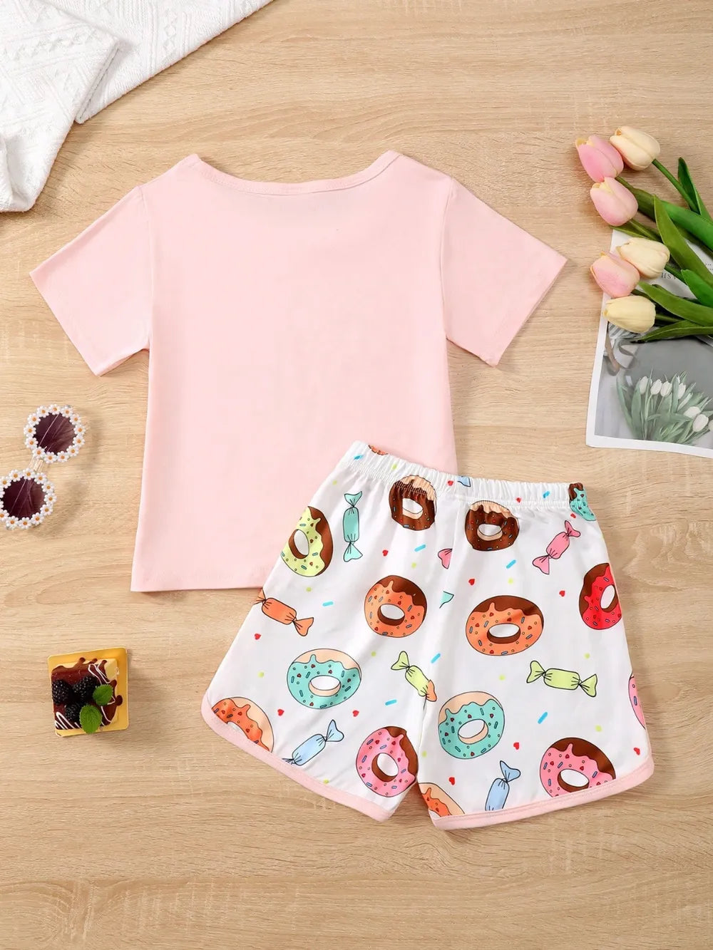 Children’s donut graphic round-neck top paired with matching pants in soft knit fabric