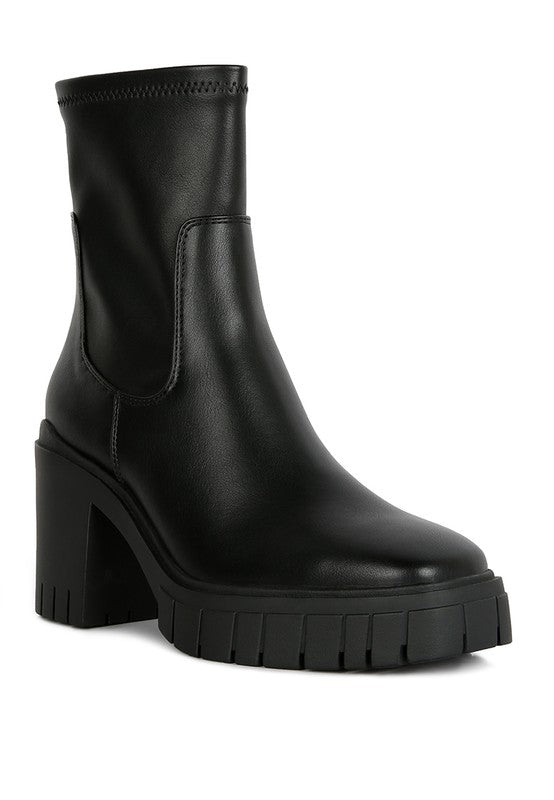 Black leather ankle boot with a chunky platform heel.