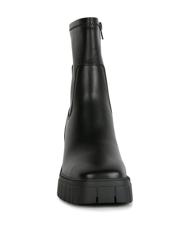 Black leather ankle boot with a chunky platform heel.