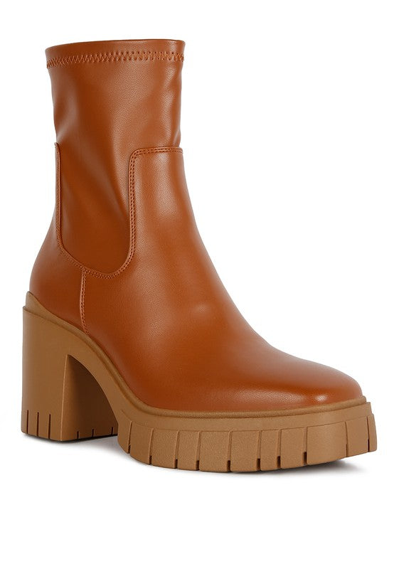 Brown leather ankle boot with a chunky platform heel.