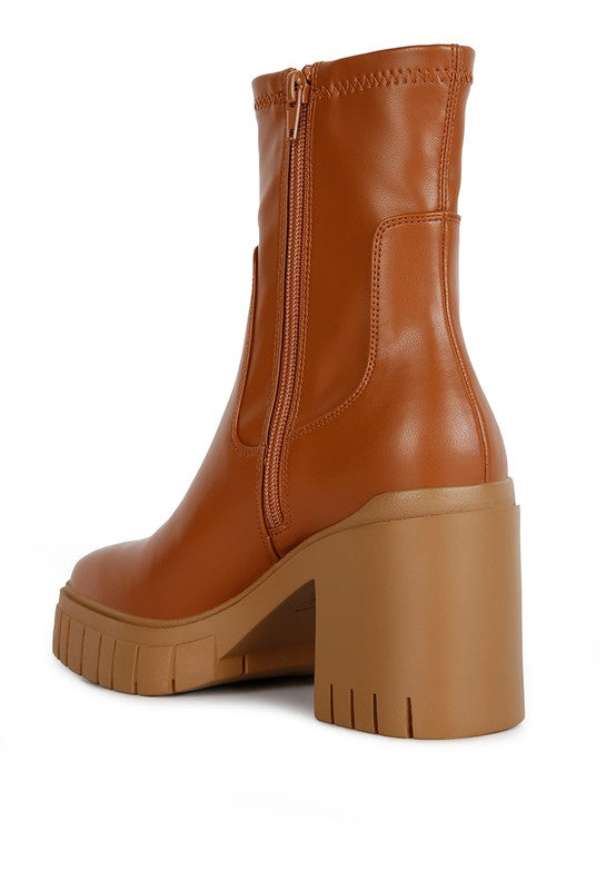 Brown leather ankle boot with a chunky platform heel.