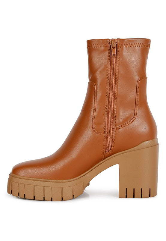 Brown leather ankle boot with a chunky platform heel.