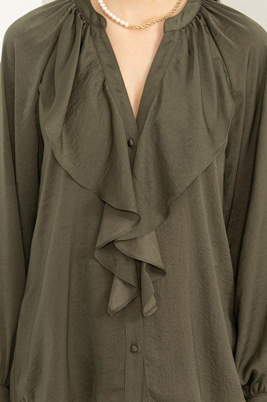 A statement top that elevates simple outfits with minimal effort.