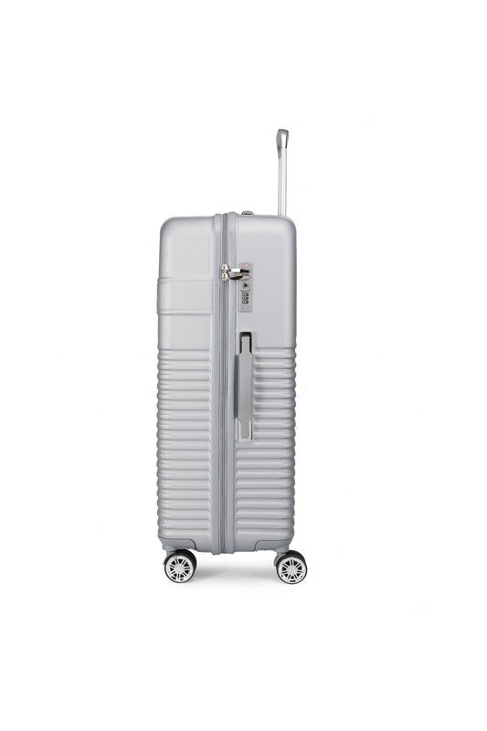 Durable hardshell luggage with a modern ribbed texture and smooth-rolling spinner wheels.