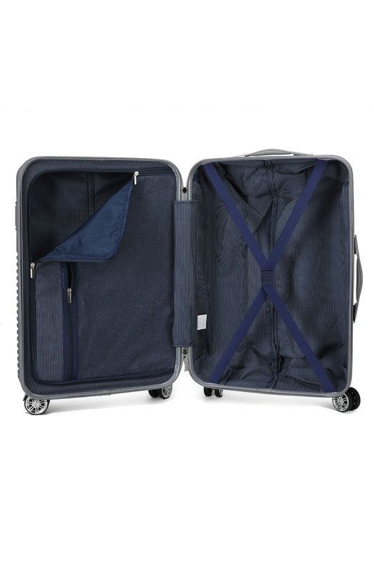 Durable hardshell luggage with a modern ribbed texture and smooth-rolling spinner wheels.
