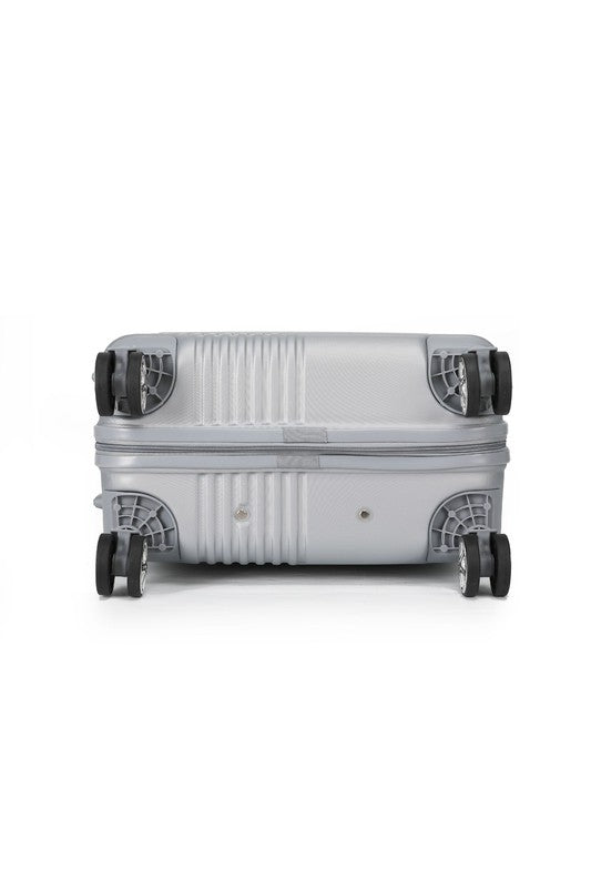Durable hardshell luggage with a modern ribbed texture and smooth-rolling spinner wheels.