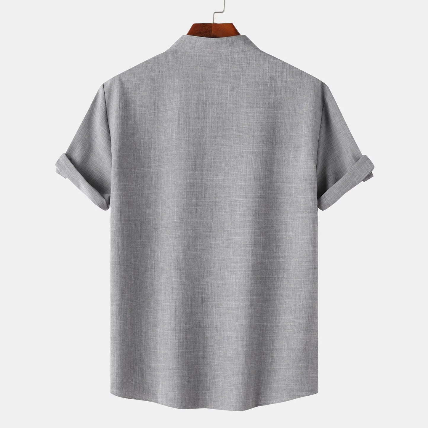 Gray short-sleeve shirt on a hanger with a white background