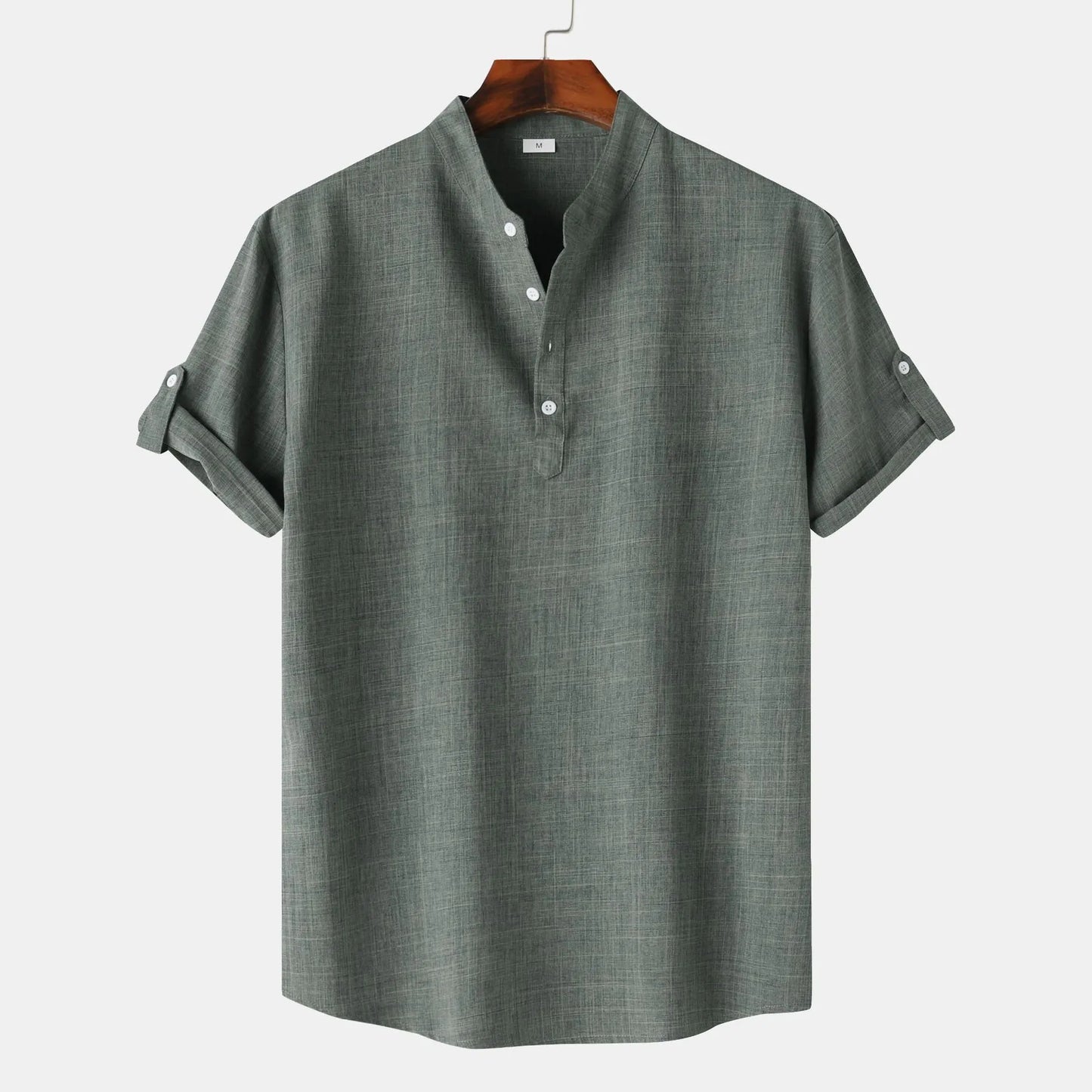 Gray short-sleeve shirt on a hanger against a white background