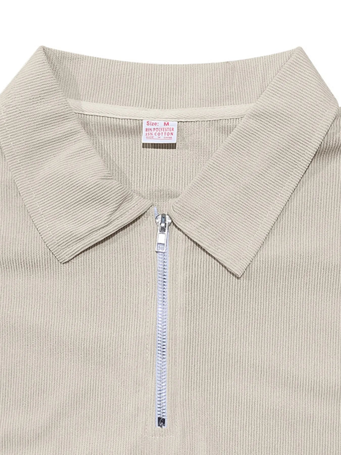 This is a plus-size men's two-piece set featuring a quarter-zip polo with short sleeves and matching pants, designed for comfortable, easy-wear versatility.