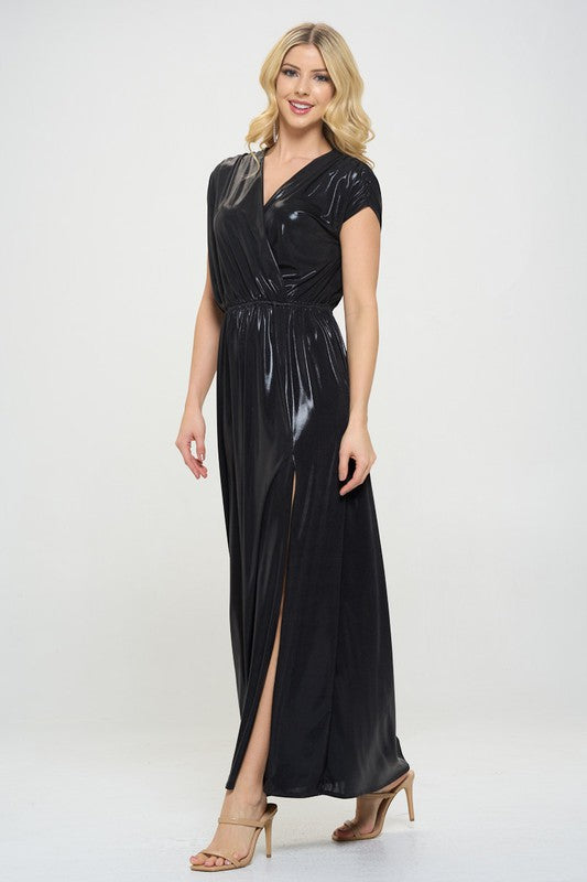 Woman wearing a black evening gown with a slit on a white background