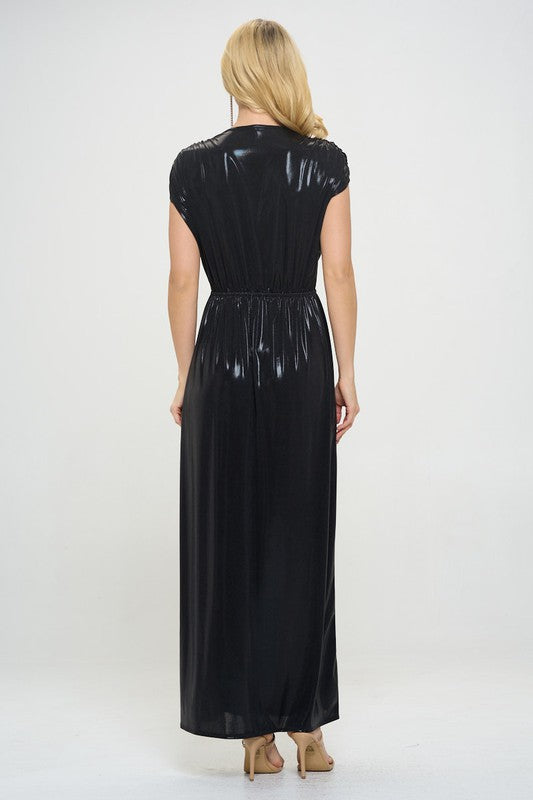 Woman wearing a black dress with a glossy finish on a white background