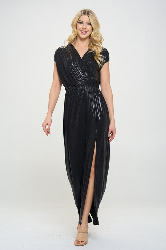 Woman wearing a black evening gown with a slit on a white background