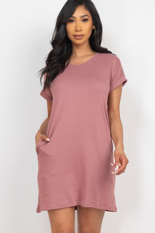 Woman wearing a pink dress against a white background