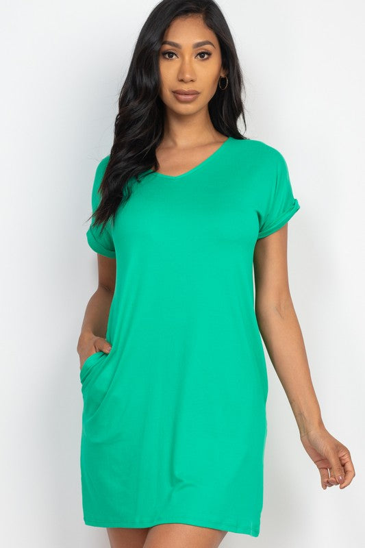 Woman wearing a green dress against a white background