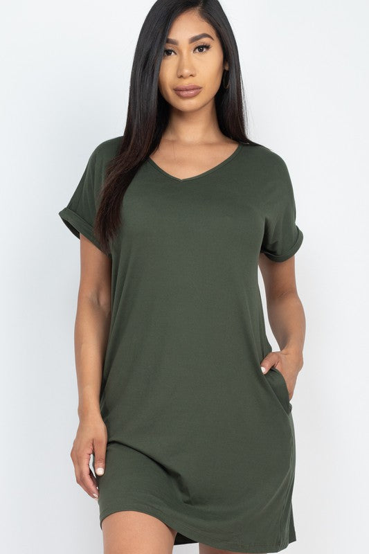 Woman wearing a green dress against a white background