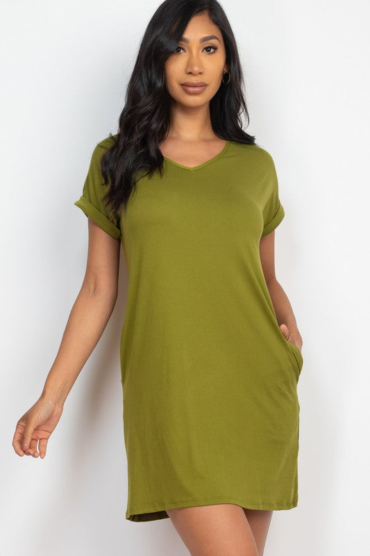 Woman wearing a green dress against a white background