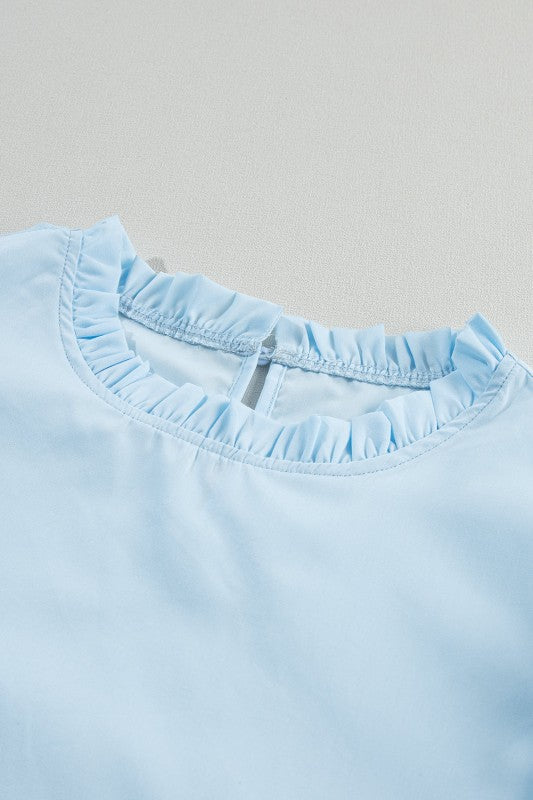 Care instructions: gentle wash to preserve frills and shape. (inferred from fabric type)
