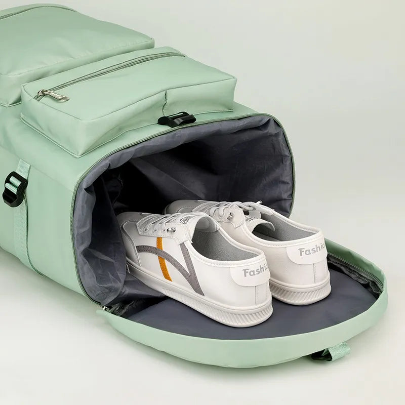 Mint green backpack with an open shoe compartment revealing white sneakers with orange and gray accents. Smart and spacious—ideal for gym, travel, or sports.