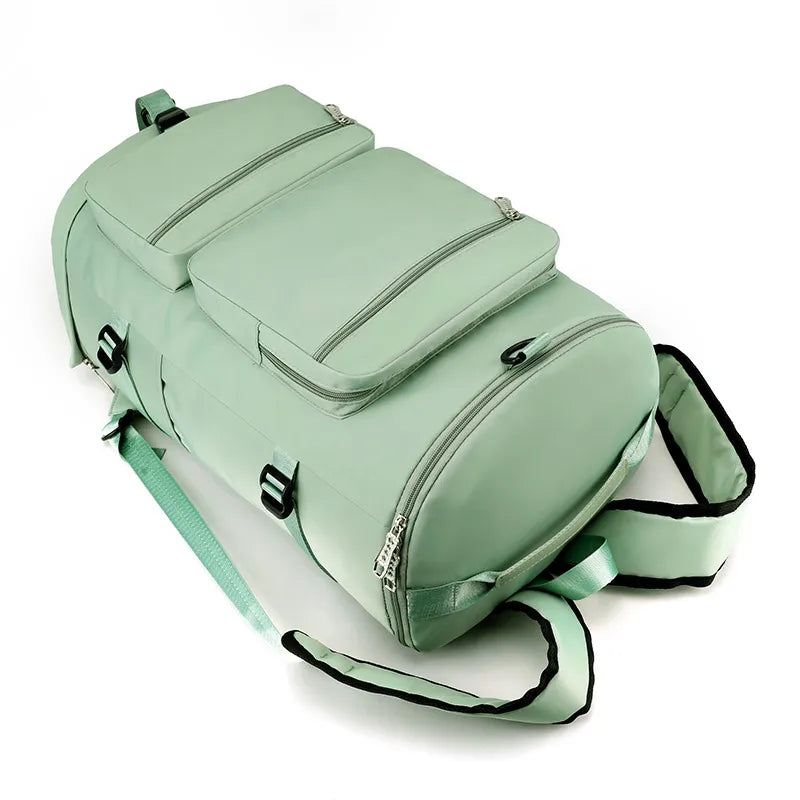 A large mint green backpack with multiple zippered compartments and side straps. Functional and stylish—great for travel or outdoor use.