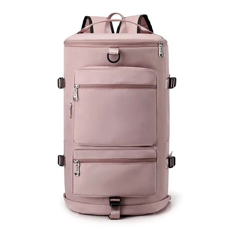Muted pink backpack with multiple zippered compartments, side buckles, and a metal D-ring. Modern and functional—great for travel, school, or everyday use.