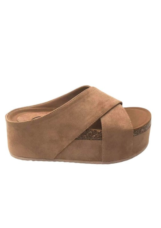 Flatform sandals featuring crossed textile bands, chunky platform sole with natural trim, open-toe cut, slip-on construction