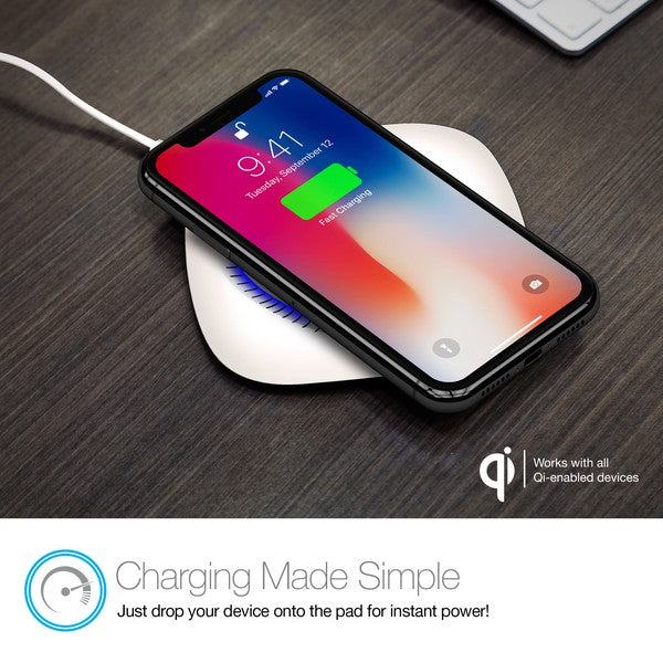 A black Naztech wireless charging pad with a glowing blue ring, actively charging a smartphone via Qi technology. Includes a USB wall adapter.