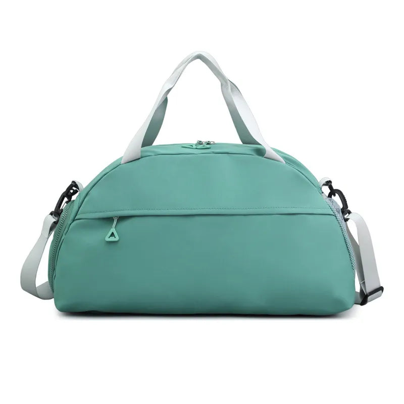 Light green duffel bag with white handles and a detachable shoulder strap, featuring a front zippered pocket with a triangular pull. Sleek and functional—perfect for gym, travel, or everyday use.