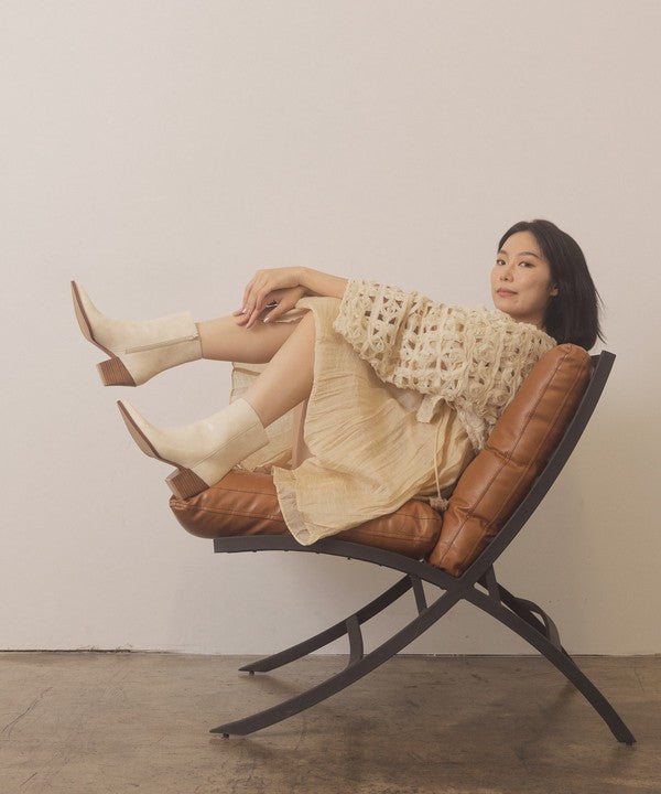 Leather ankle boots with square toe, stacked wooden block heel, side zipper closure, and slip-on style