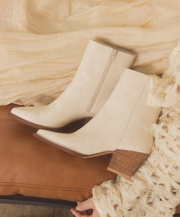 Leather ankle boots with square toe, stacked wooden block heel, side zipper closure, and slip-on style