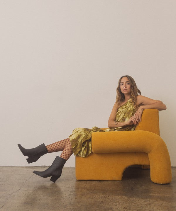 Leather ankle boots with square toe, stacked wooden block heel, side zipper closure, and slip-on style