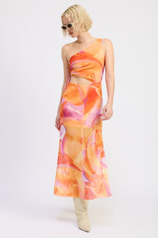 A lady wearing a one-shoulder maxi dress with an abstract orange, pink, and yellow print.