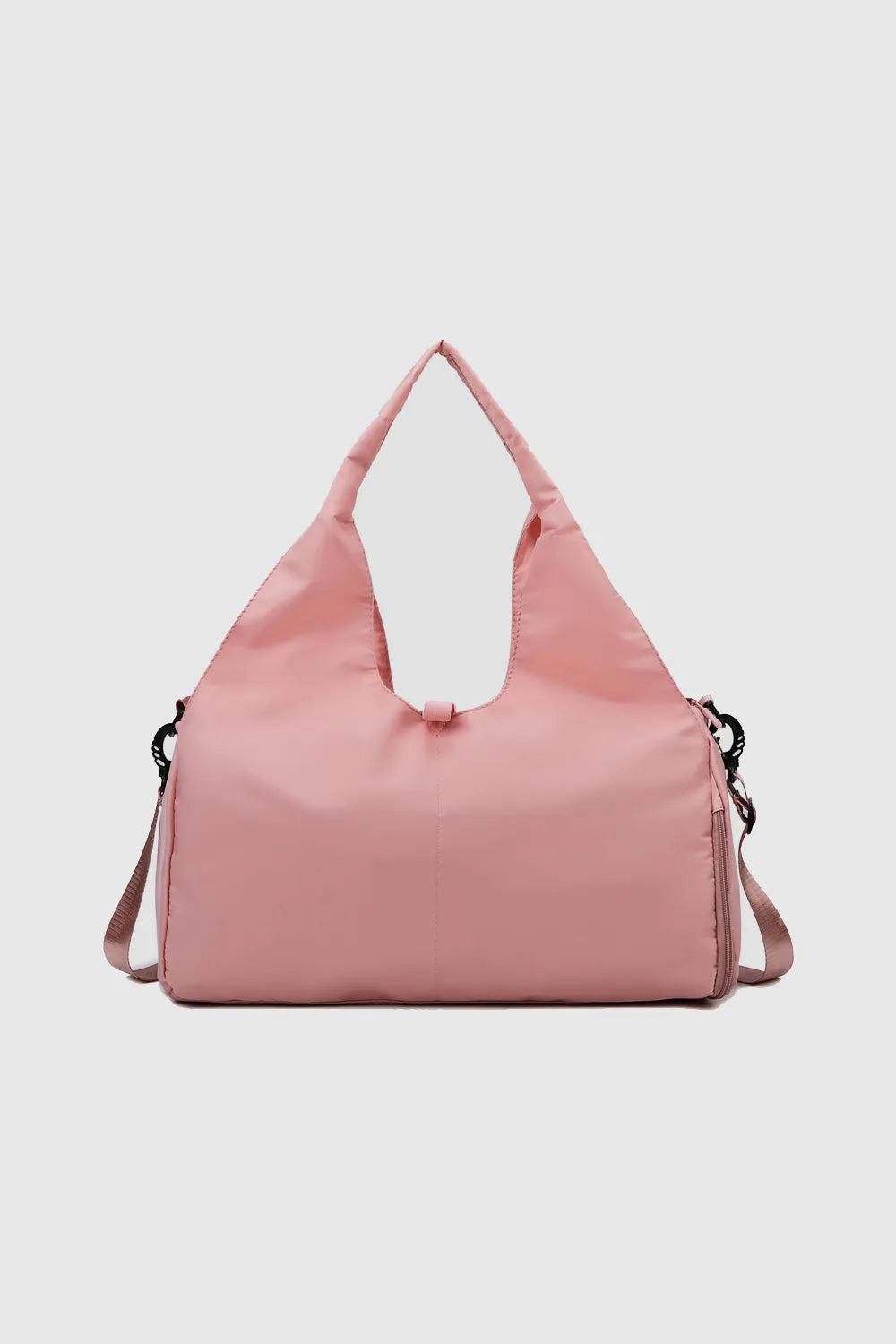 Pink handbag with a soft texture and unique triangular handle, featuring a detachable shoulder strap. Stylish and spacious—great for casual or everyday use.