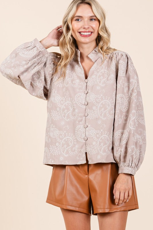 The paisley print pairs beautifully with eyelet lace for a refined yet playful aesthetic.