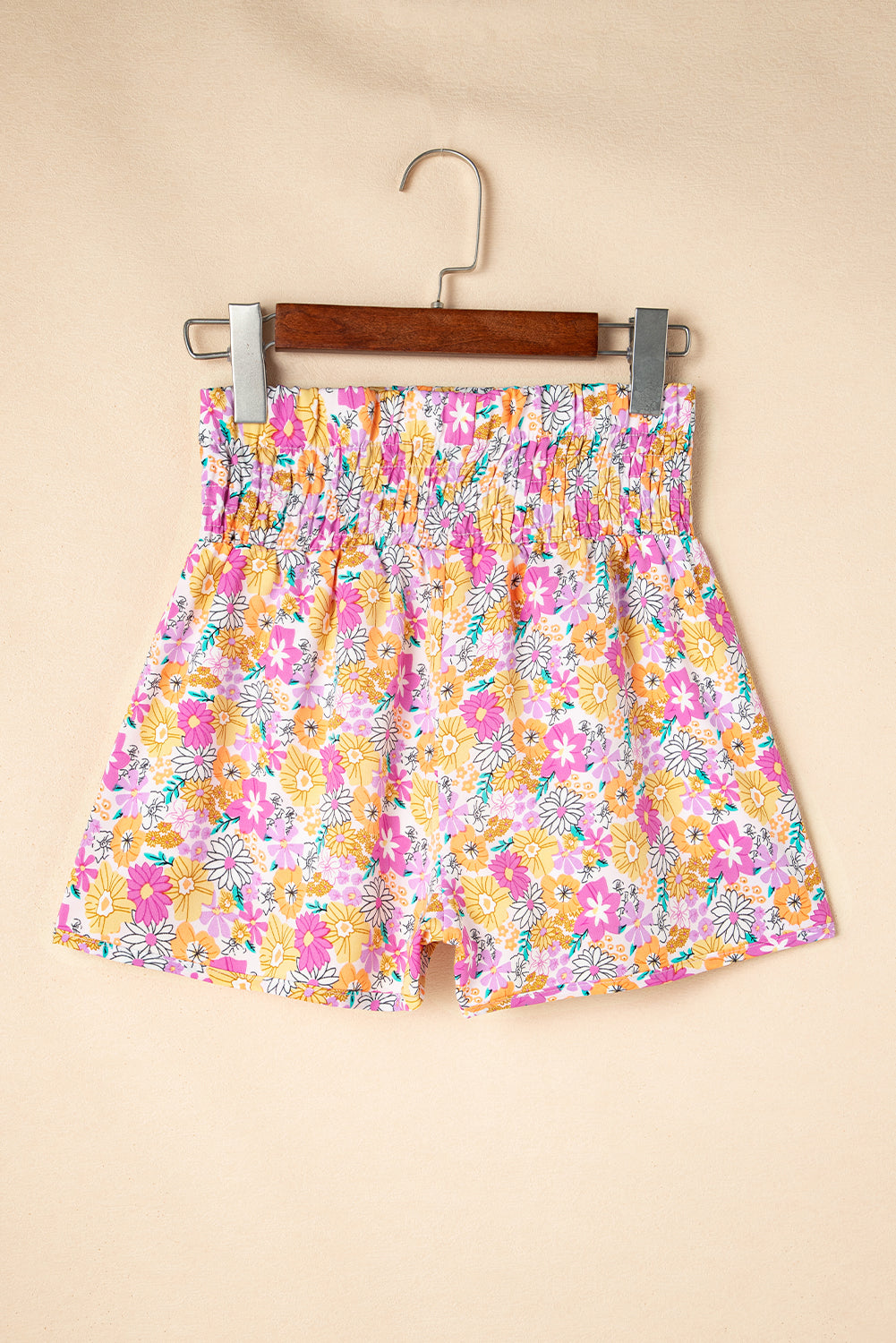 Floral, flirty, and free-spirited. These pink boho shorts are your go-to for warm-weather adventures, featuring a shirred high waist and a relaxed fit that flatters every curve. Whether you're headed to a beach day, brunch, or a music festival, these shorts bring effortless style and comfort.