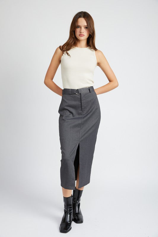 Woman wearing a white sleeveless top and gray pinstripe skirt on a white background
