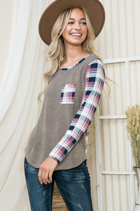 Lightweight pullover blending solid knit and plaid print for a fresh take on cozy.
