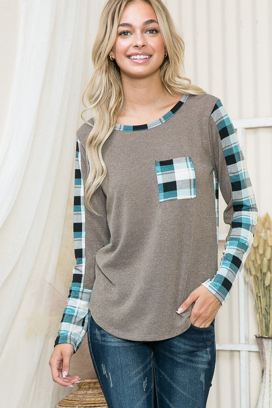 A modern sweater that merges relaxed shape with tailored plaid accents.